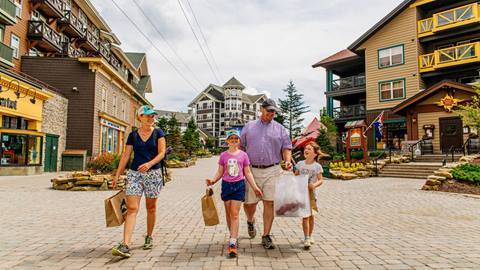 Family walking in the Village